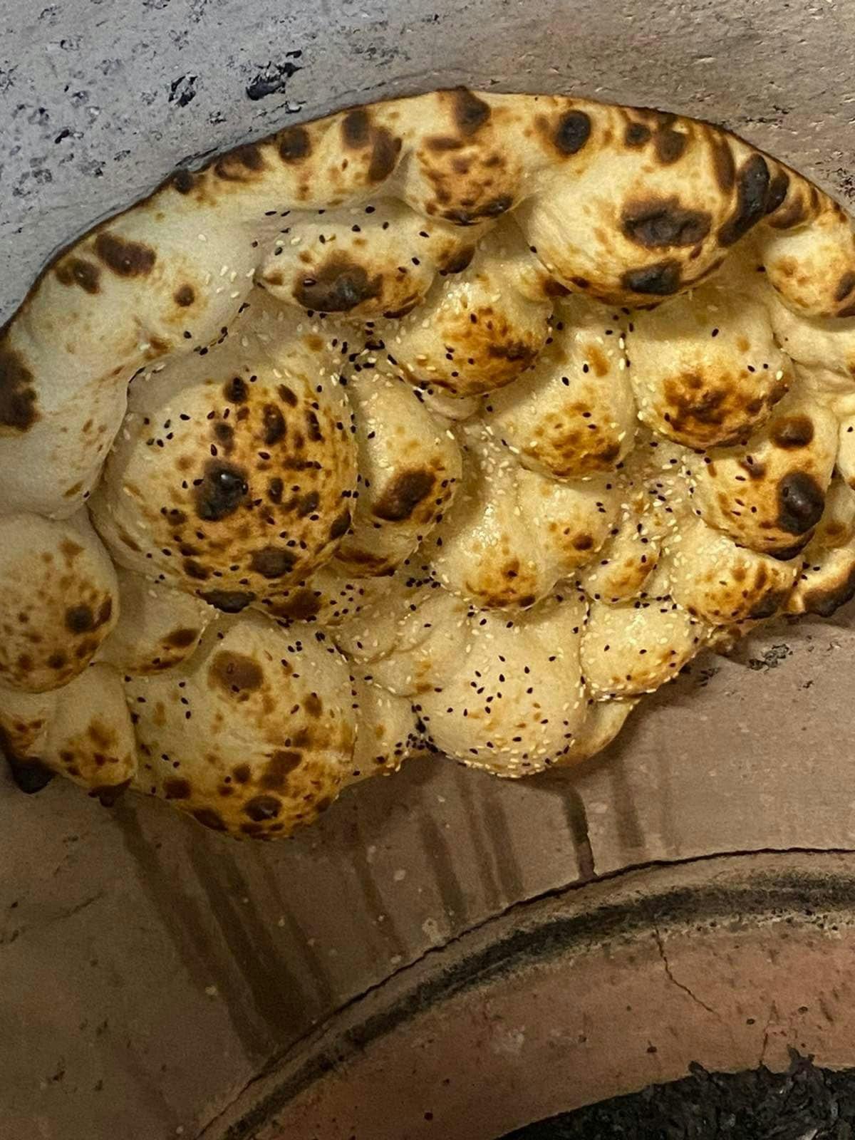 Fluffy and fresh seasoned Naan Bread baked in store